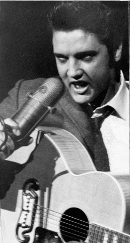 October-13.-Elvis-Presley-performs-to-a-full-house-of-girls-at-the-Sam-Houston-Coliseum-in-Houston