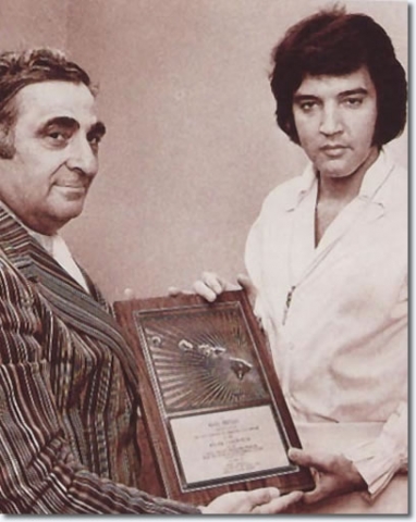 Elvis-Presley-Receiving-an-award-January-13-1973-before-his-Aloha-Concert