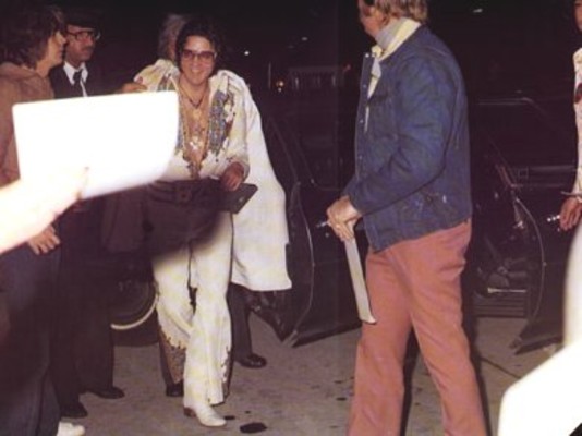 A smiling Elvis before his 12/30/76 Atlanta show and as he arrives at the airport after his great show on December 30, 1976 in Atlanta