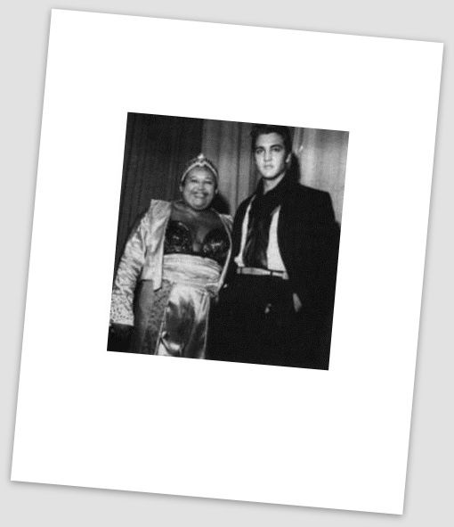 Elvis Presley is pictured with WDIA's first female African-American disc jockey, Willa Monroe at the WDIA Goodwill Revue at Ellis Auditorium in Memphis, TN on Friday, December 6, 1957