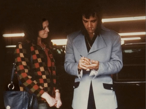 Elvis Presley, signing an autograph for a fan in Las Vegas on January 22, 1973