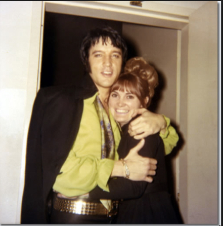 Elvis Presley, backstage with a fan in Las Vegas on February 18, 1970