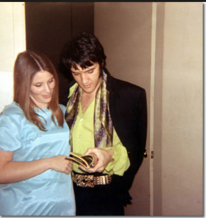 Elvis Presley, backstage with a fan in Las Vegas on February 18, 1970