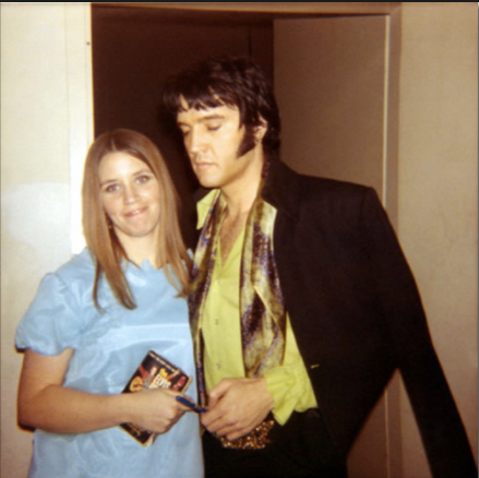 Elvis Presley, backstage with a fan in Las Vegas on February 18, 1970