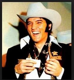 Elvis Presley receives a membership card & Texas cowboy hat prior to his performance - Houston Stock Show & Rodeo - Astrodome - Houston, february 27 1970