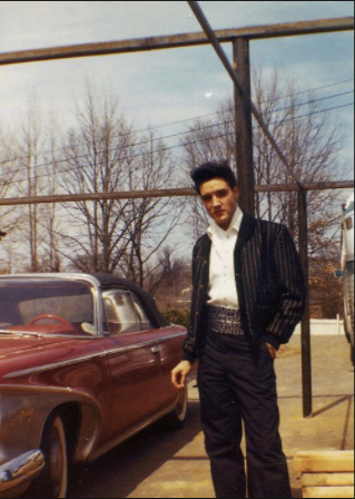 Candid photograph of Elvis Presley at the back of Graceland, March 20, 1960.