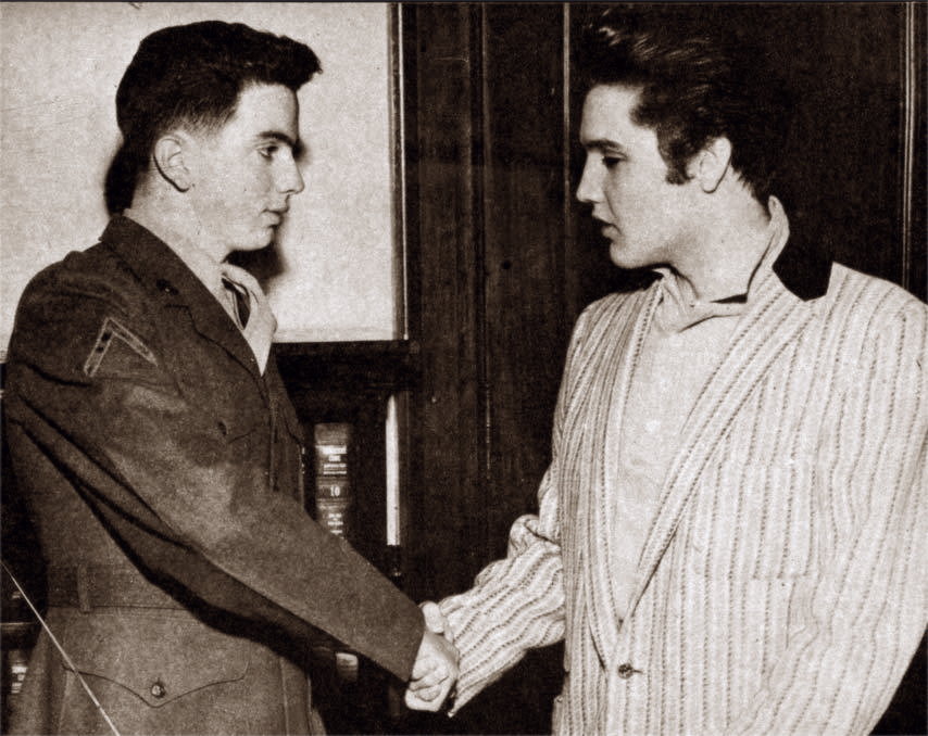 Hershel Nixon and Elvis Presley shake hands march 26 1957 . The March 22