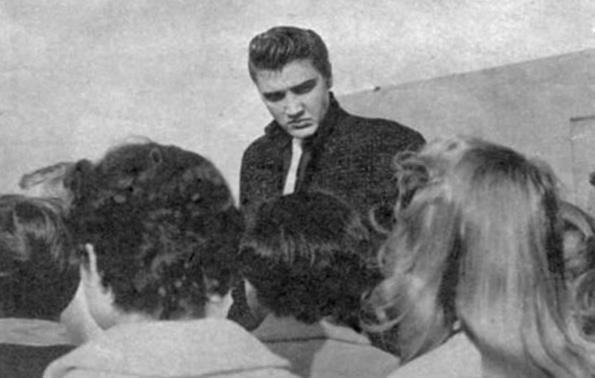 Elvis Presley with fans at p.a. in San Diego April. 3, 1956.