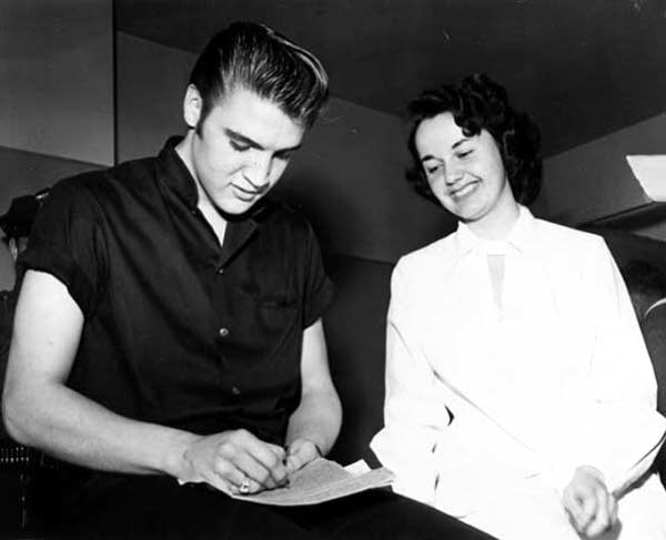 Elvis Presley signing autographs in St. Paul, May 13, 1956.