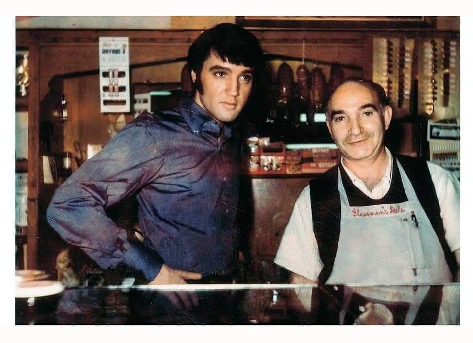 Elvis posing with original employee of Glassman’s Market store in Hollywood, where som filming was done for Change of Habit.