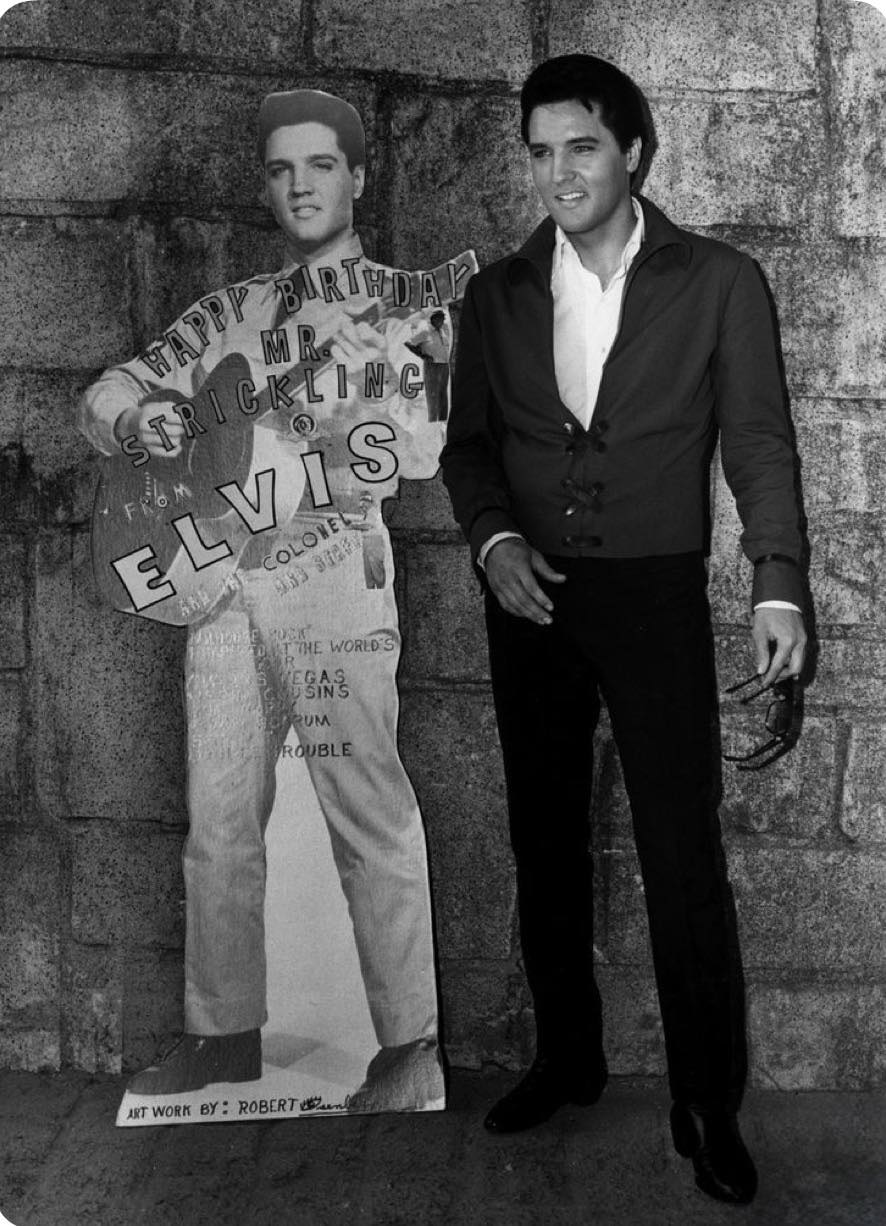 Elvis alongside a life size cardboard cutout of himself on January 27th 1966